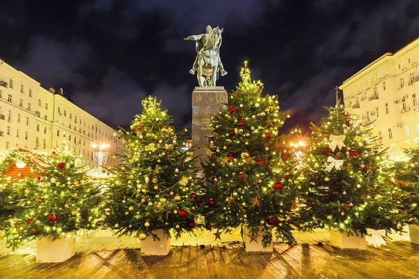 Christmas in Moscow. Tverskaya Square in Moscow. The inscription on the monument in Russian: the founder of Moscow, Yuri Dolgoruky.