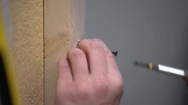 Man Worker Person Using Screwdriver Screws Screw Hole Wooden Board — стоковое видео