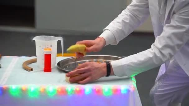 Man White Coat Holding Banana Frozen Liquid Nitrogen Hits Banana — Stock Video