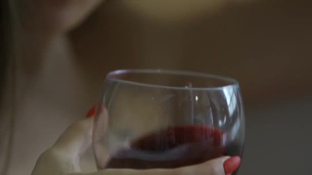 Woman Hand Red Manicure Holds Glass Red Wine Shakes Wine — Stock Video