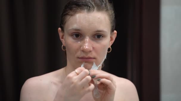 European Woman Standing Mirror Bathroom Removes Face Mask Woman Removes — Stock Video