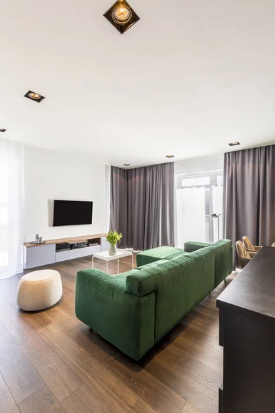 Spacious Living Room Interior Green Corner Sofa Wooden Floor Gray — Stock Photo, Image