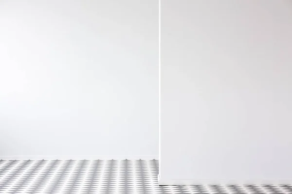 Checkerboard floor in empty interior with copy space on white wall. Place for your furniture.