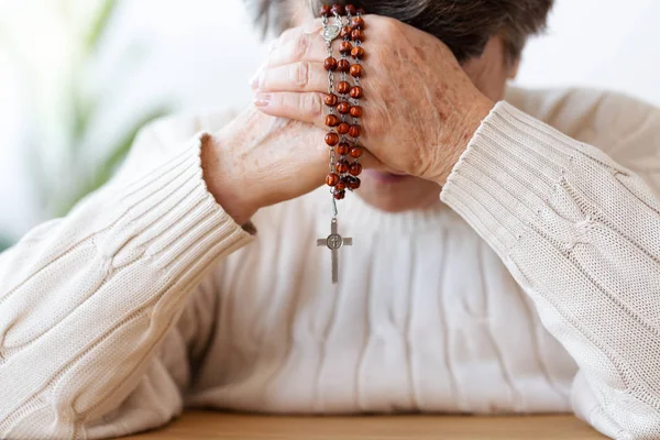 Close Religious Senior Person Praying Red Rosary Focus Hands — Stock Photo, Image