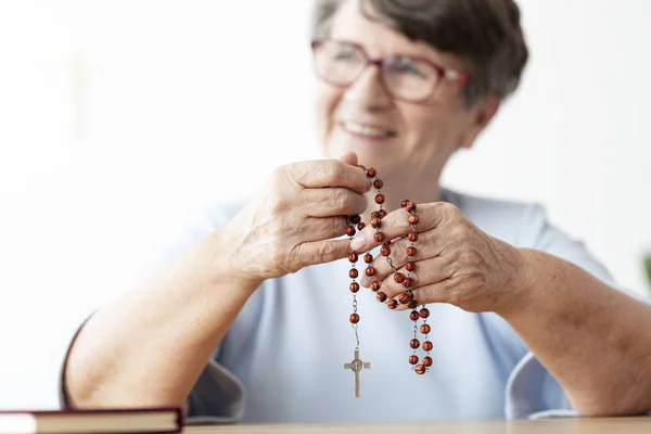 Smiling Religious Senior Woman Holding Rosary Cross Focus Hands — Stock Photo, Image