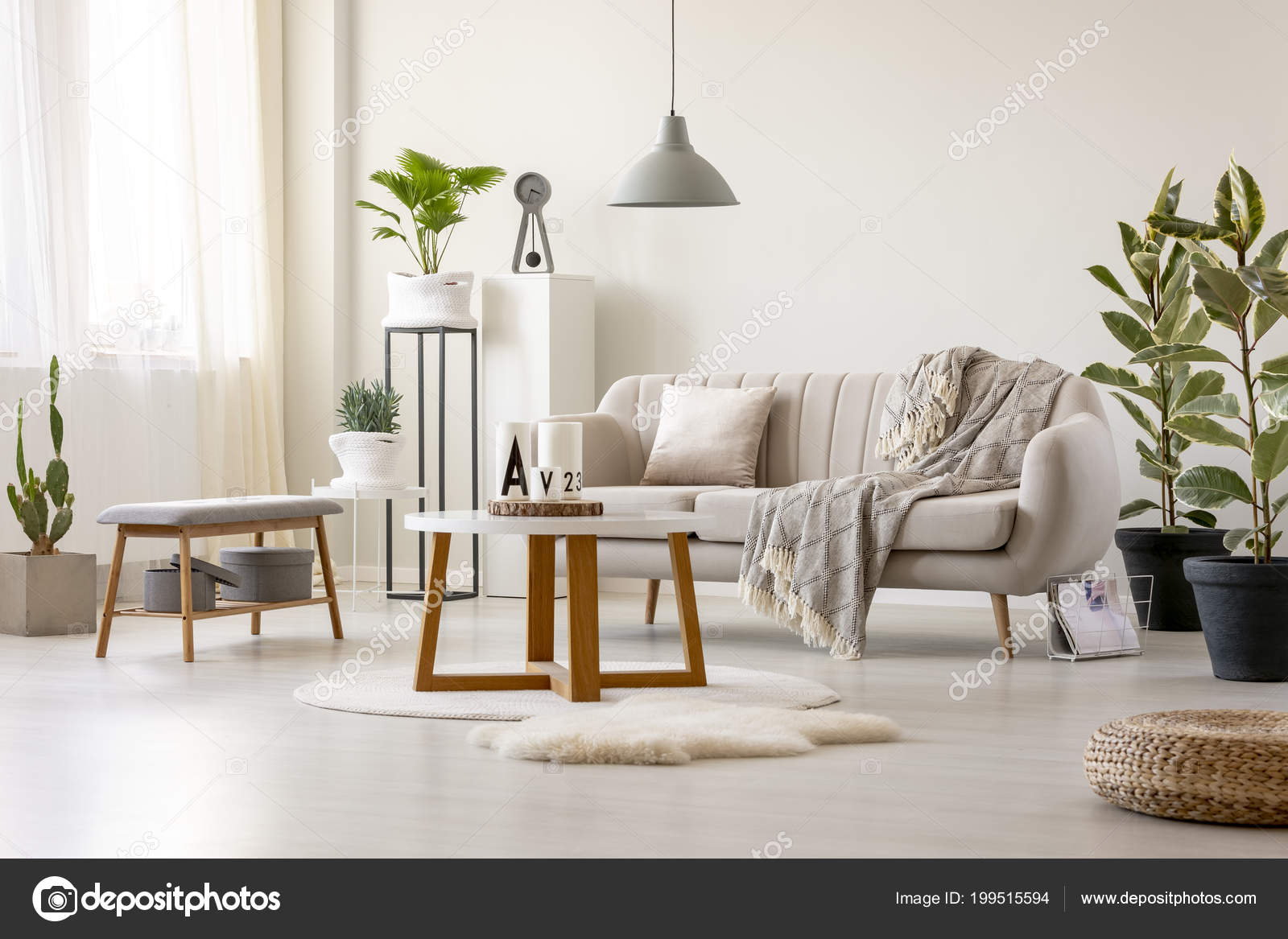 Real Photo Beige Sofa Cushion Blanket Standing Front Table Lamp Real Photo Of A Beige Sofa With Cushion And Blanket Standing In Front Table Under Lamp Living Room Interior Plants Decorations