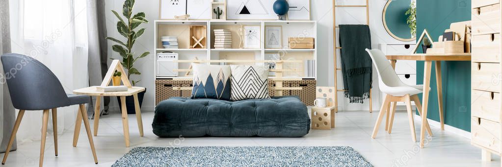 Panorama of a stylish white and green teenager room interior with sofa and scandinavian design workspace