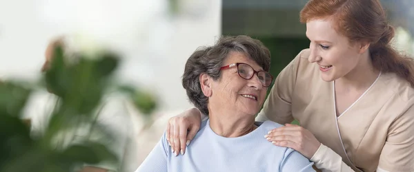 Close Tender Caregiver Her Hands Shoulders Senior Woman Her Home — Stock Photo, Image