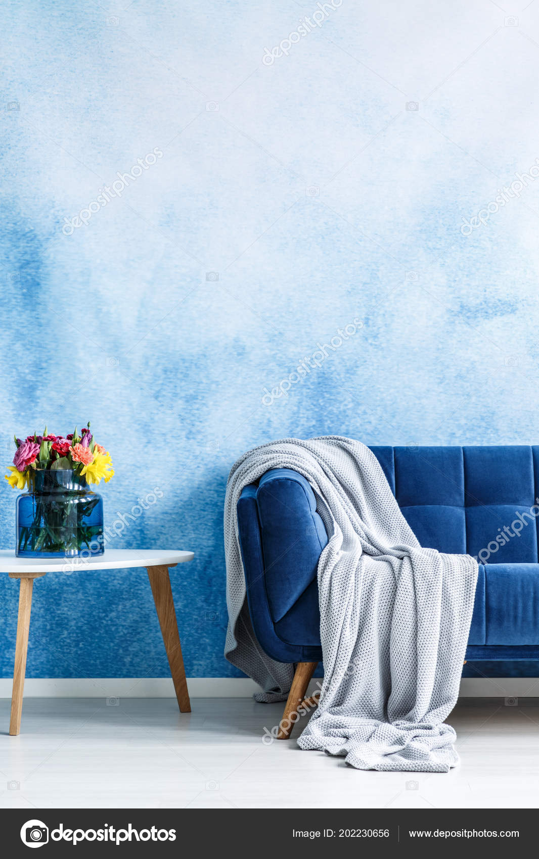 fortable Dark Blue Settee Gray Blanket Small Side Table depositphotos stock photo fortable dark blue settee gray