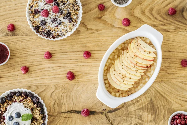 Top View Bowls Apple Pie Muesli Berries Wooden Table Raspberries — Stock Photo, Image
