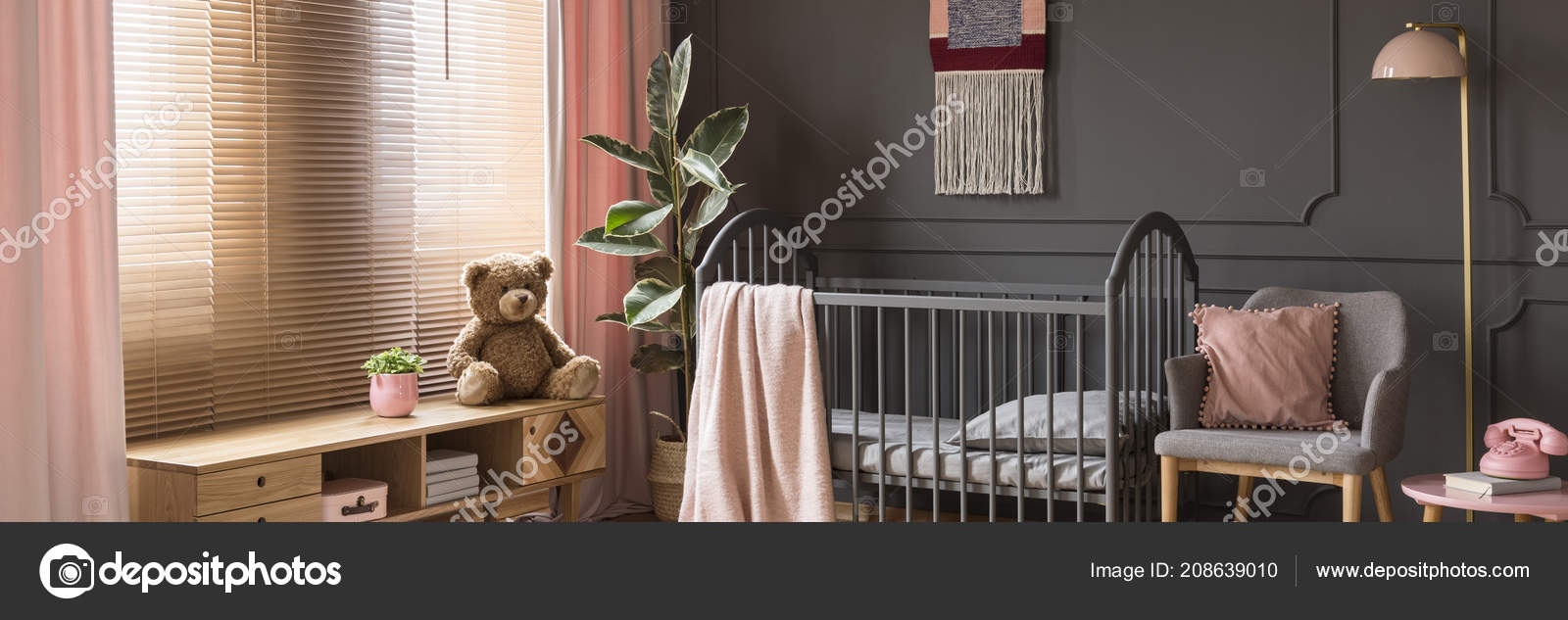pink and gray nursery with dark furniture