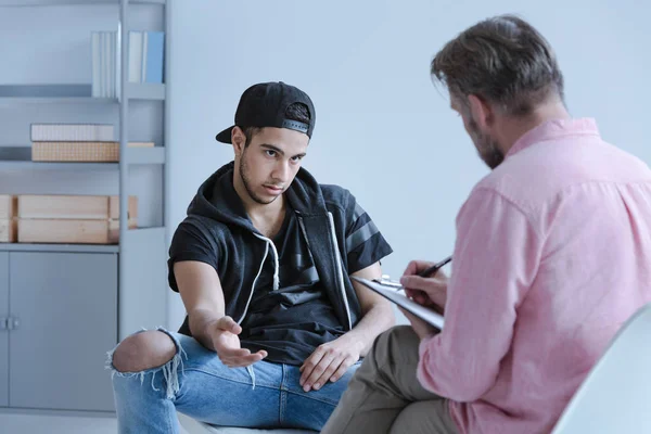 Rebellious Juvenile Boy Trouble Explaining His Behavior Curator Taking Notes — Stock Photo, Image