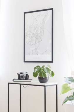 A city map poster on a white wall, plant and camera on a box frame, marble top table in a stylish living room interior for a traveler clipart