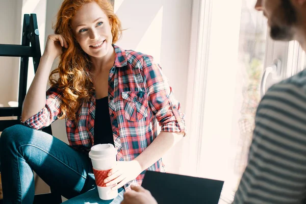 Smiling Red Haired Woman Drinking Coffee Talking Friend Home — Stock Photo, Image