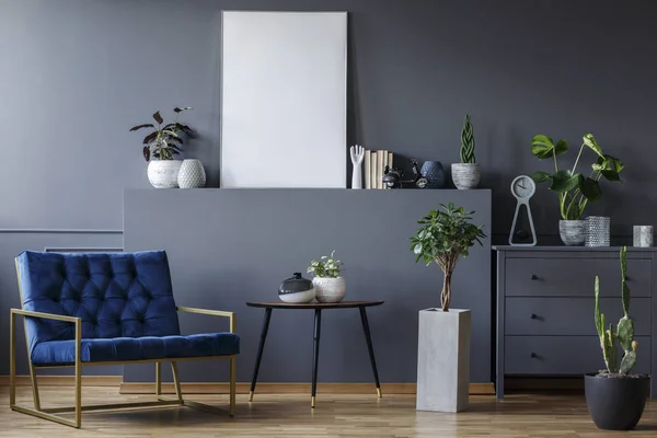 Real Photo Wide Blue Armchair Standing Next Table Cupboard Grey — Stock Photo, Image