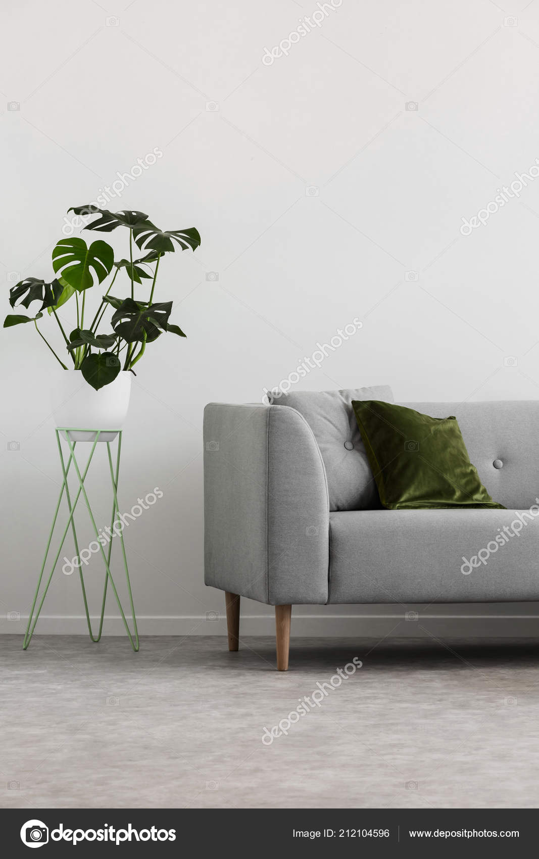 grey couch green pillows