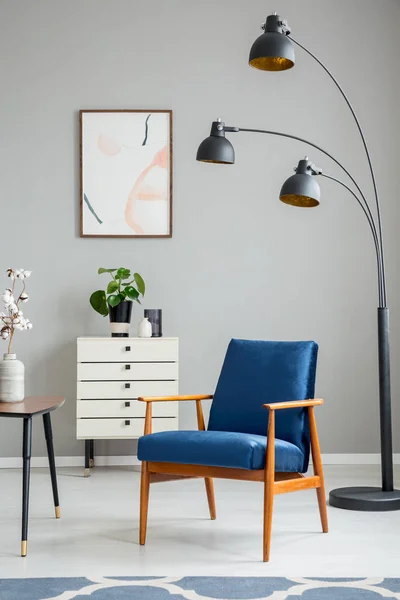 Black Lamp Next Blue Wooden Armchair Grey Apartment Interior Poster — Stock Photo, Image