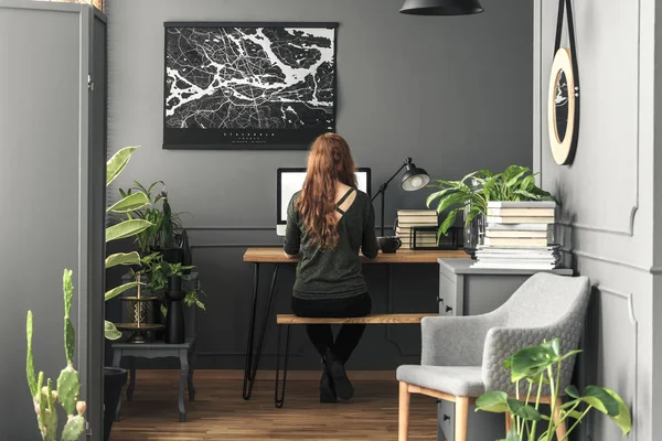 Woman Working Desk Lamp Grey Workspace Interior Poster Armchair Real — Stock Photo, Image