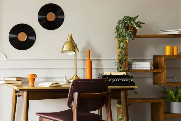 Gold Lamp Typewriter Desk Freelancer Interior Vinyl Chair Plants Настоящее — стоковое фото