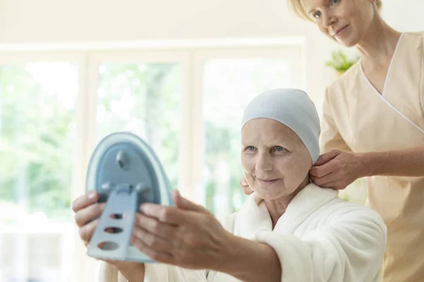 Happy Sick Elderly Woman Headscarf Caregiver Looking Mirror — Stock Photo, Image
