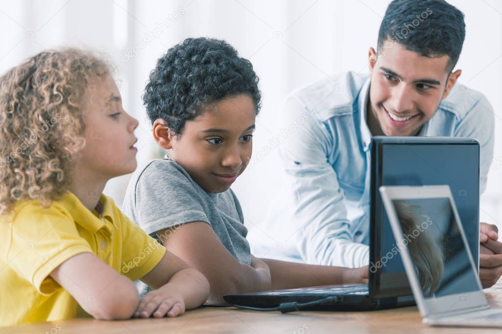 Two clever boys during computer coding class for kids