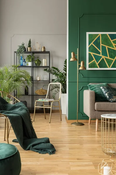 Emerald green interior with grey accents, urban jungle and fancy furniture