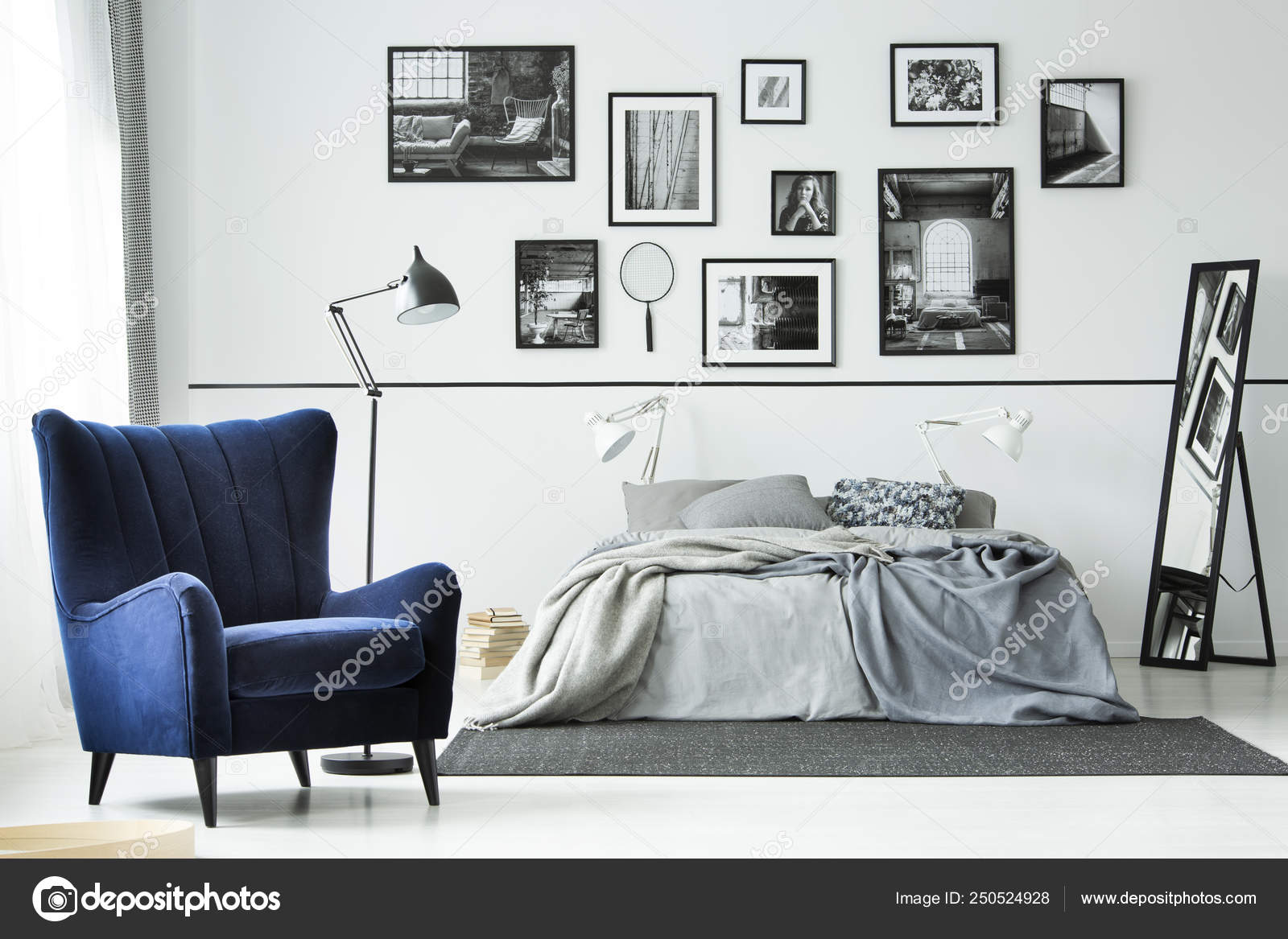 Comfortable Blue Armchair In Monochromatic Bedroom Interior