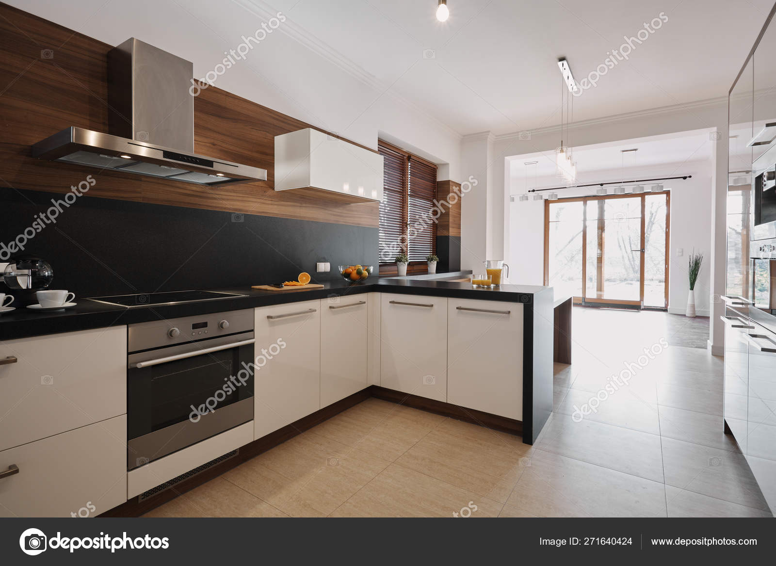 Elegant White And Black Kitchen With Wooden Accents And Open