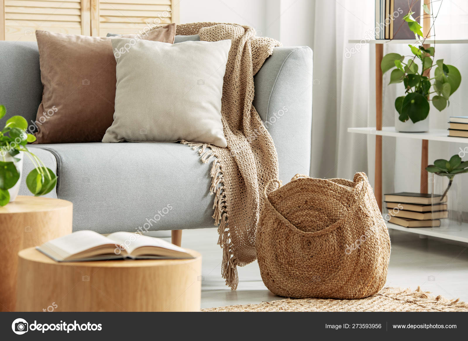 Close-up of patterned beige cushions and small pottery bowl on sofa Stock  Photo - Alamy