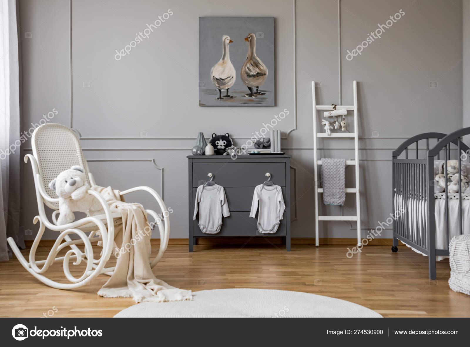 Baby Clothes Hanging On Knobs On Grey Wooden Commode In Lovely