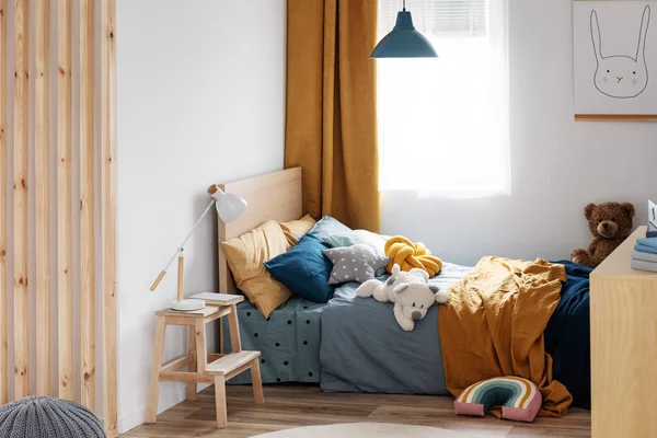 Stylish blue and orange kid's bedroom design in bright apartment — Stock Photo, Image