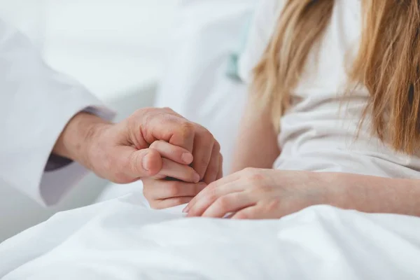 Adult holding hand of a sick child — Stock Photo, Image