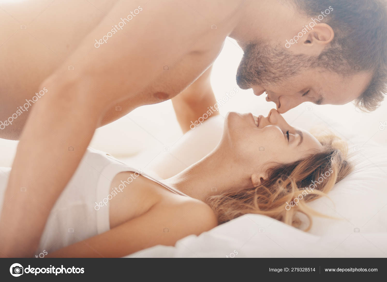 Handsome man and beautiful woman gazing into each others eyes during sex Stock Photo by ©photographee.eu 279328514