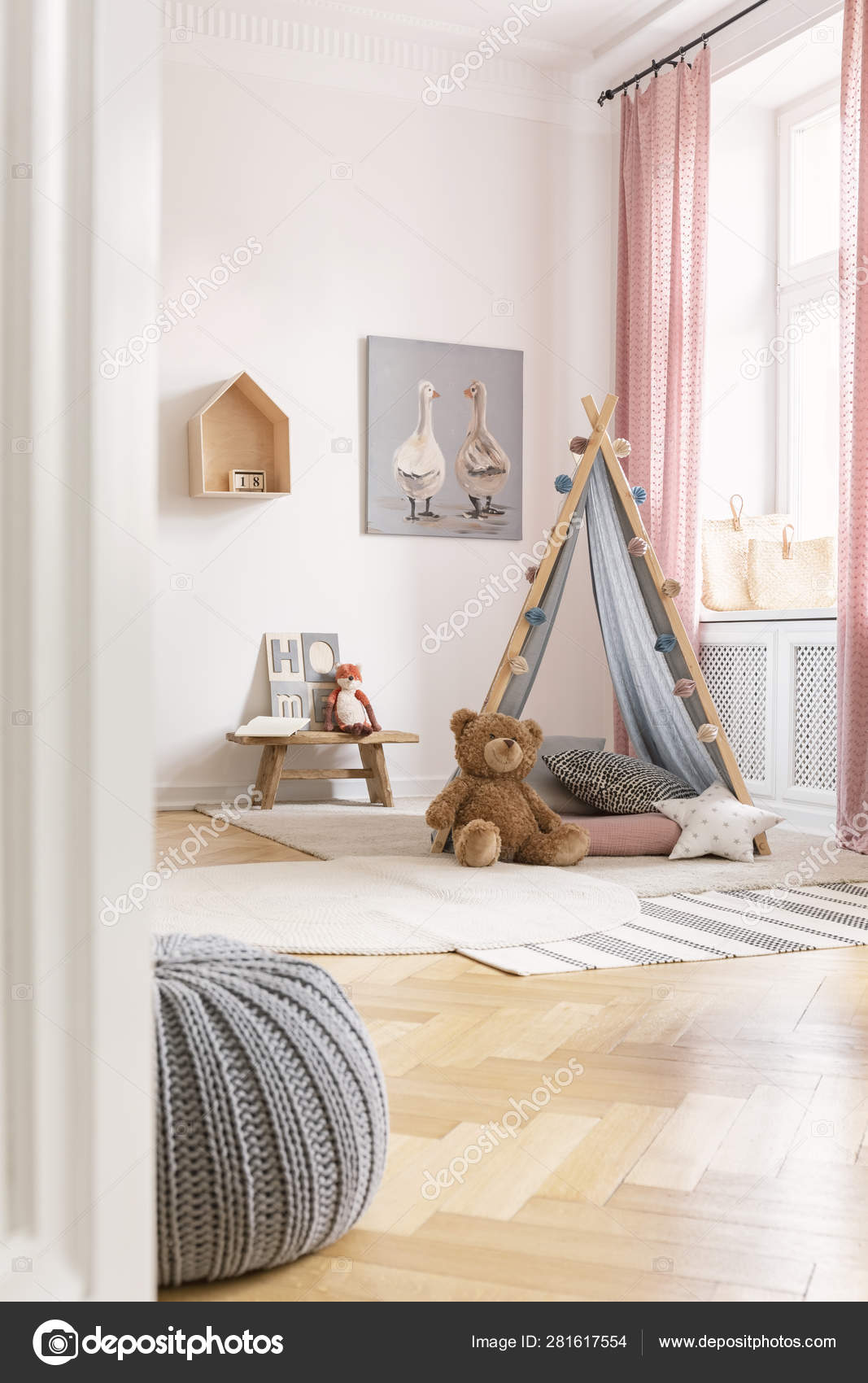 Vertical view of scandinavian kids bedroom with tent, toys