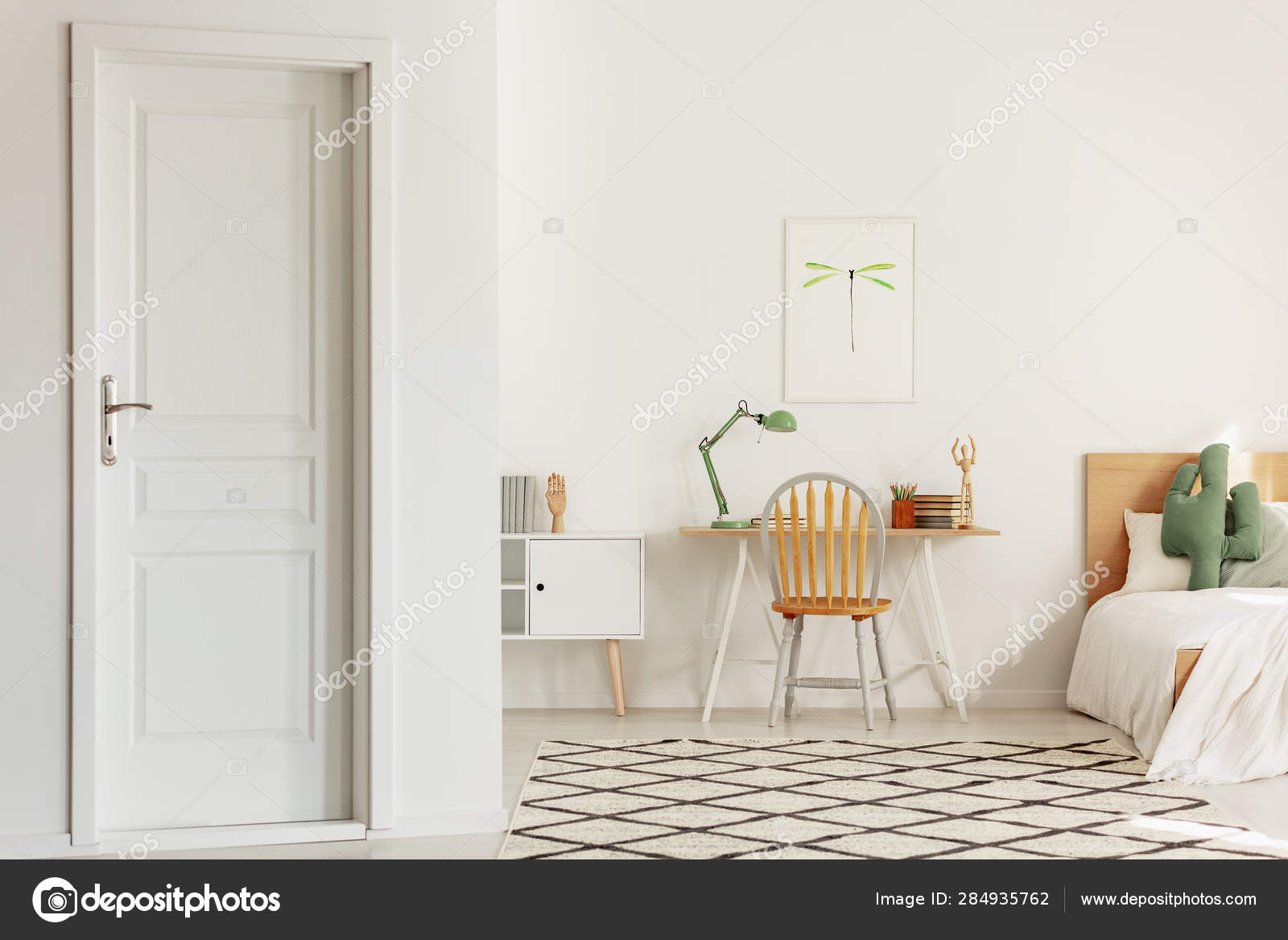Wooden Chair In Front Of Scandinavian Desk In Elegant Bedroom With