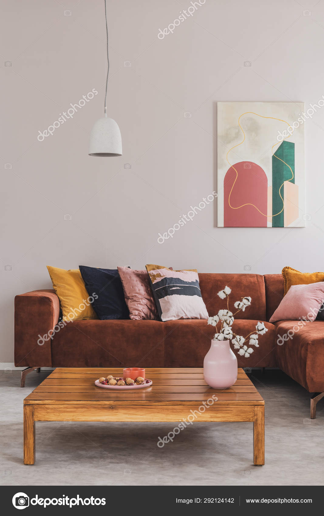 Flowers In Vase On Wooden Coffee Table In Fashionable Living Room