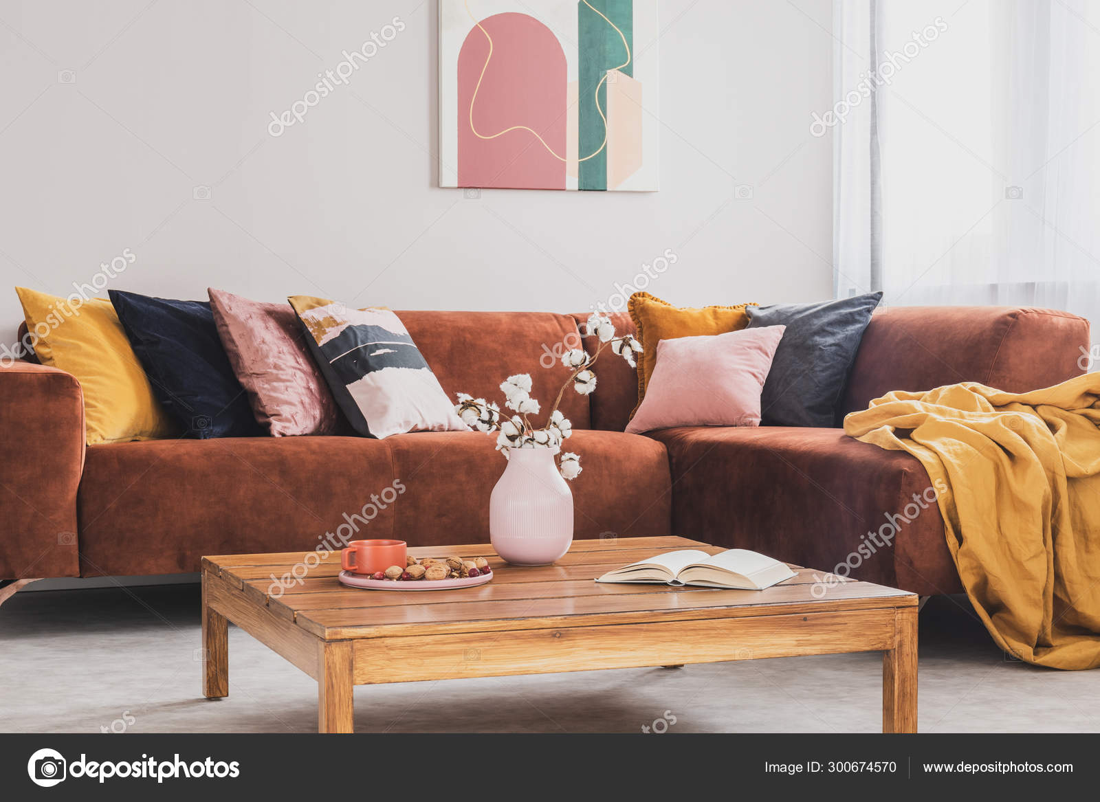 Flowers In Vase On Wooden Coffee Table In Fashionable Living Room