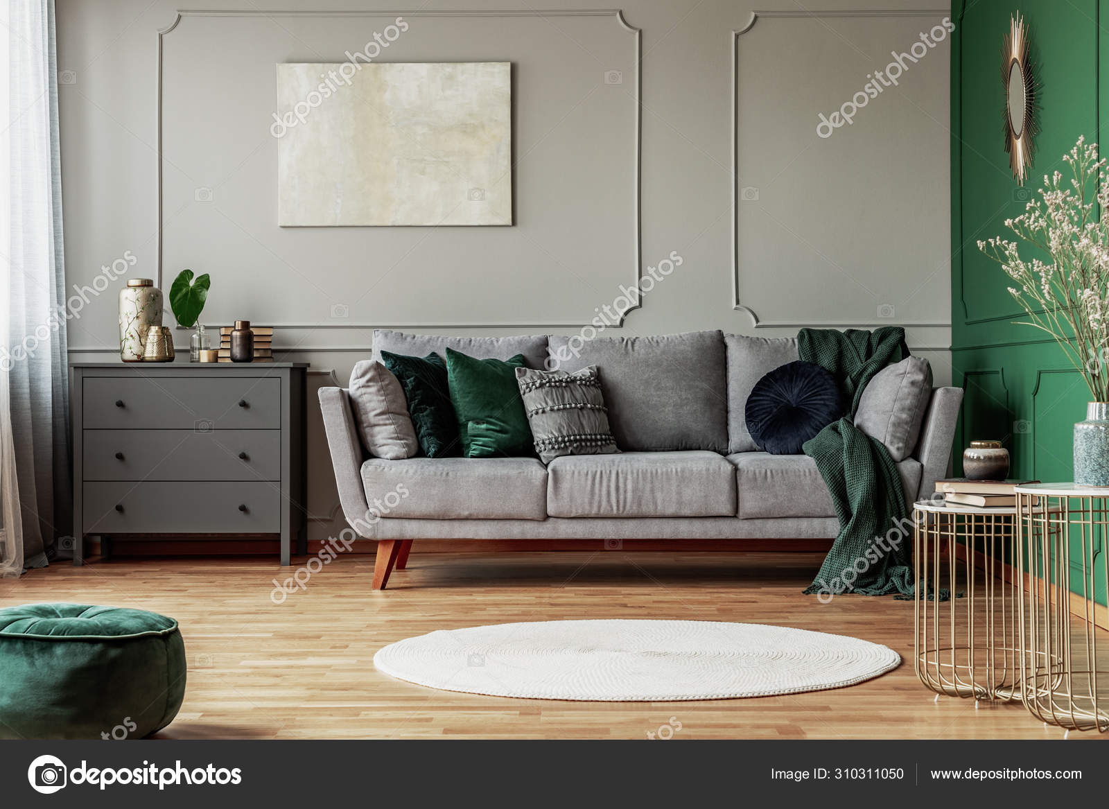 Stylish emerald green and grey living room interior design with