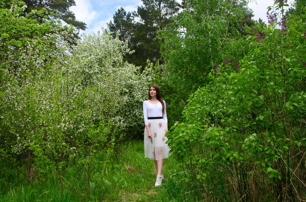 beautiful girl in a blooming Park