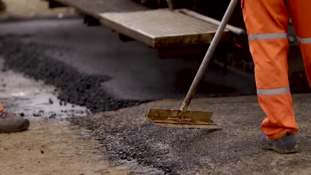 Trimming new rad. Asphalt on the road. Bitumen — Stock Footage Trimming new rad. Asphalt on the road. Bitumen Royalty Free Stock Footage