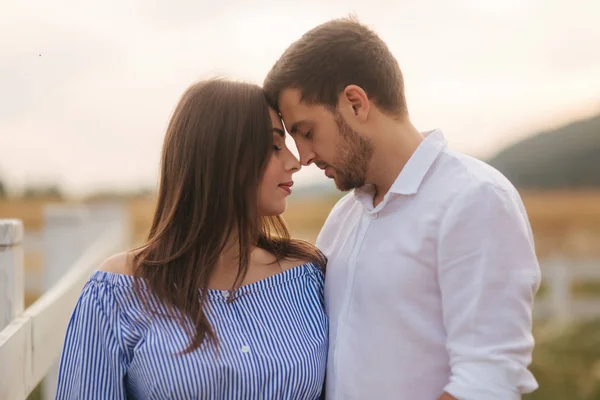 Pregnant woman and man hug each other and show their love. Couple waiting for baby girl — Stock Photo, Image