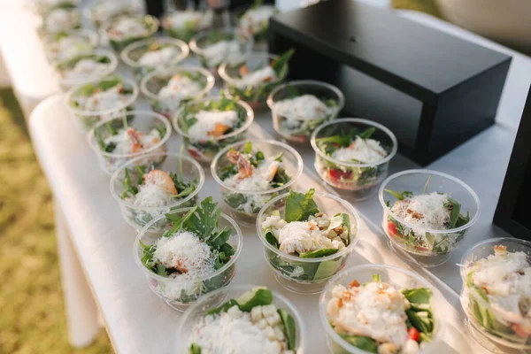 Different luzury snacks and antipasto on party. Gig table with snack outdoors — Stock Photo, Image