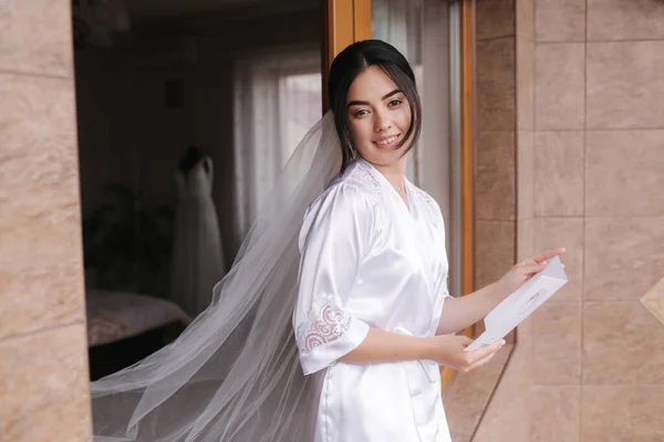 Young bride hold wedding oath and read. Brides morning