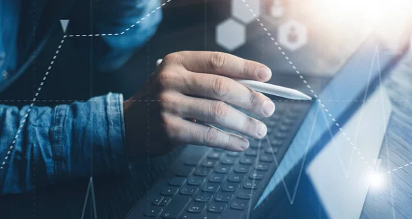 Businessman using tablet device and electronic pen stylus while working at office.Closeup view of male hands pointing tablet screen and typing keyboard. — Stock Photo, Image