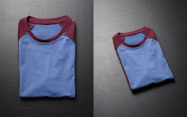 Vintage katlanmış t-shirt yalanlar üzerine bir siyah ahşap masa arka plan boş. Amerikan Hipsters retro klasik giyim önden görünümü.