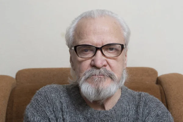 A lonely sick poor old man suffering from eye diseases, independently engaged in conservative treatment of cataract and glaucoma.