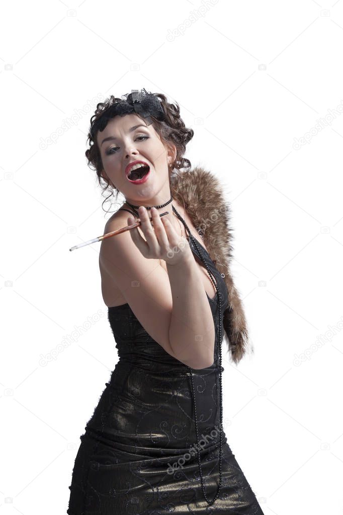 Sexy, emotional woman in retro style with mouthpiece posing and dancing in front of camera in studio