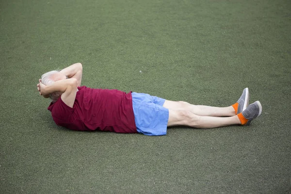 Senior man exercising in an open stadium