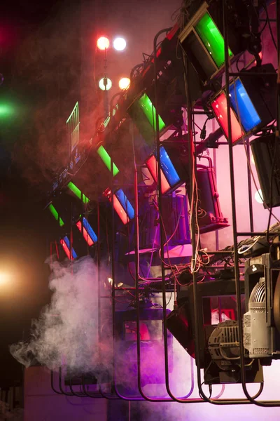 Theater light on stage. Light effects on stage created with theatrical lighting equipment and a smoke machine