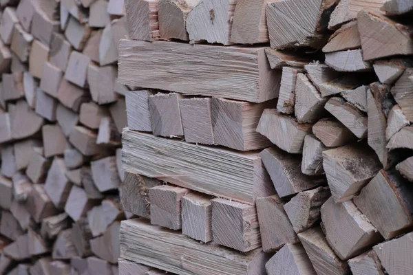Pile of logs in front of a house. Selective focus. — Stock Image Pile Logs Front House Selective Focus Royalty Free Stock Images